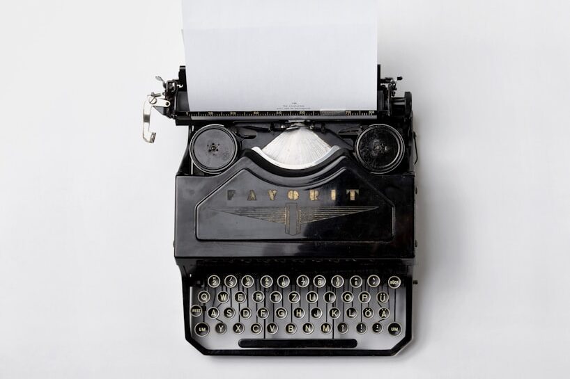 black Fayorit typewriter with printer paper